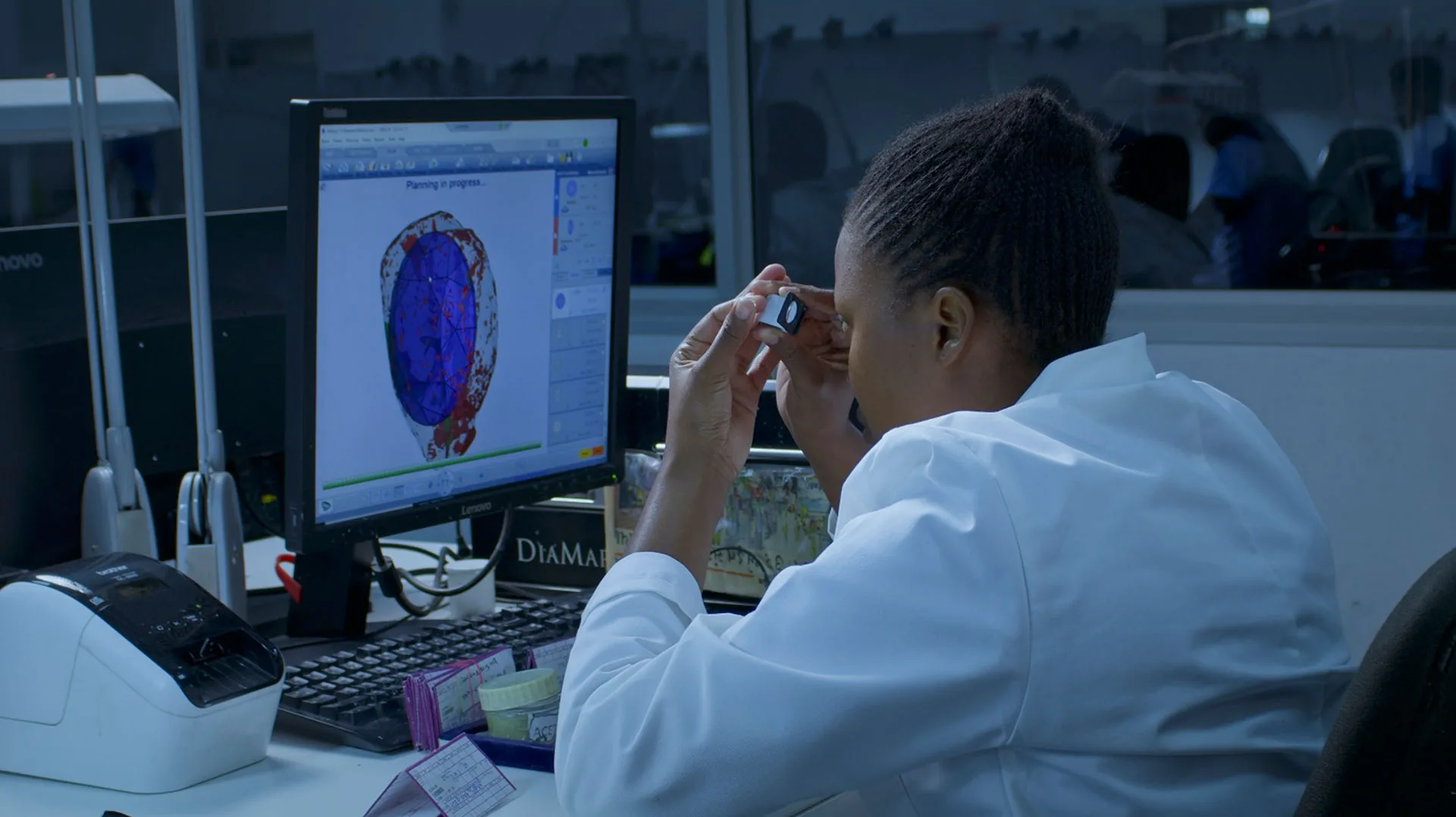 A gemologist mapping a rough diamond's internal structure
