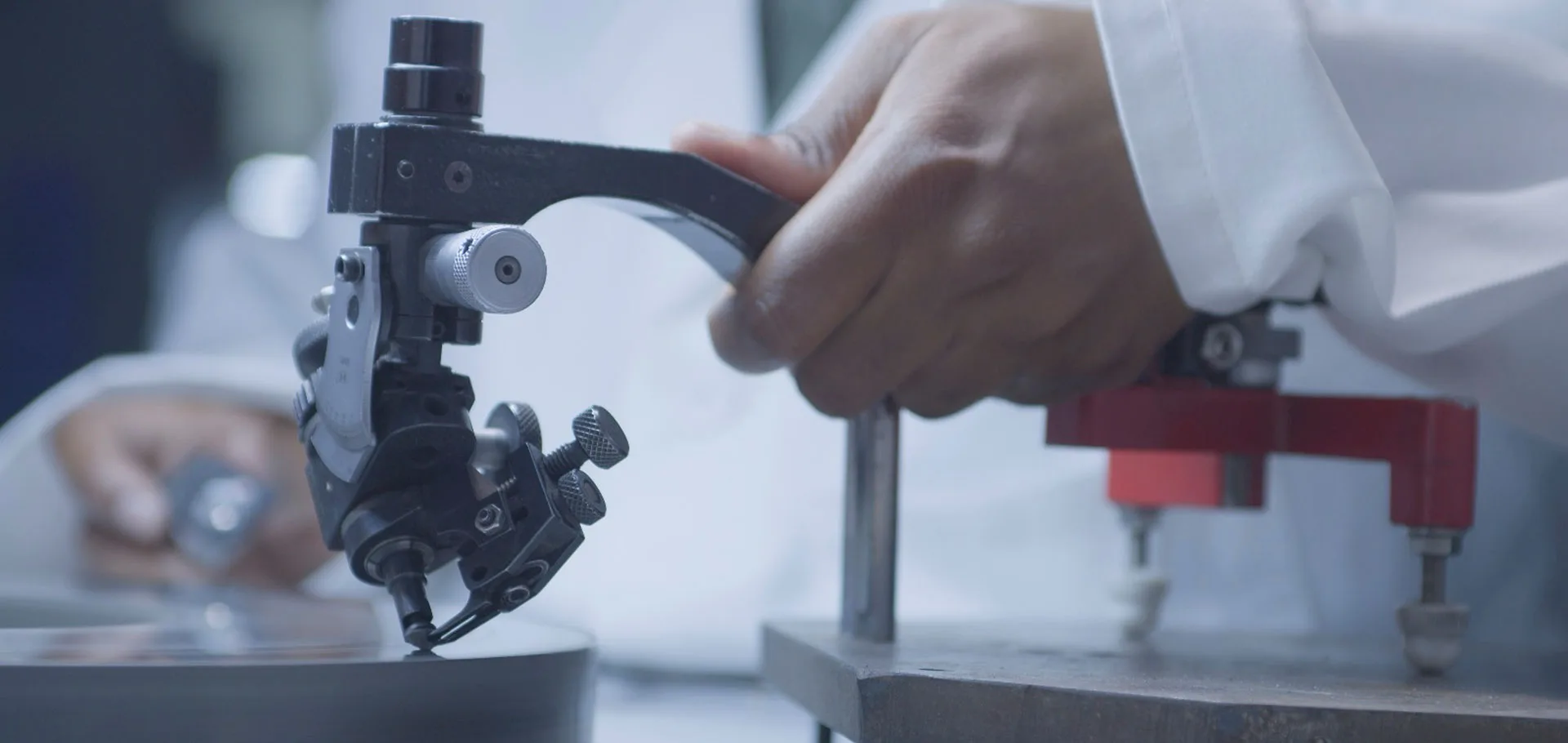 A diamantaire cutting a rough diamond under precision tools