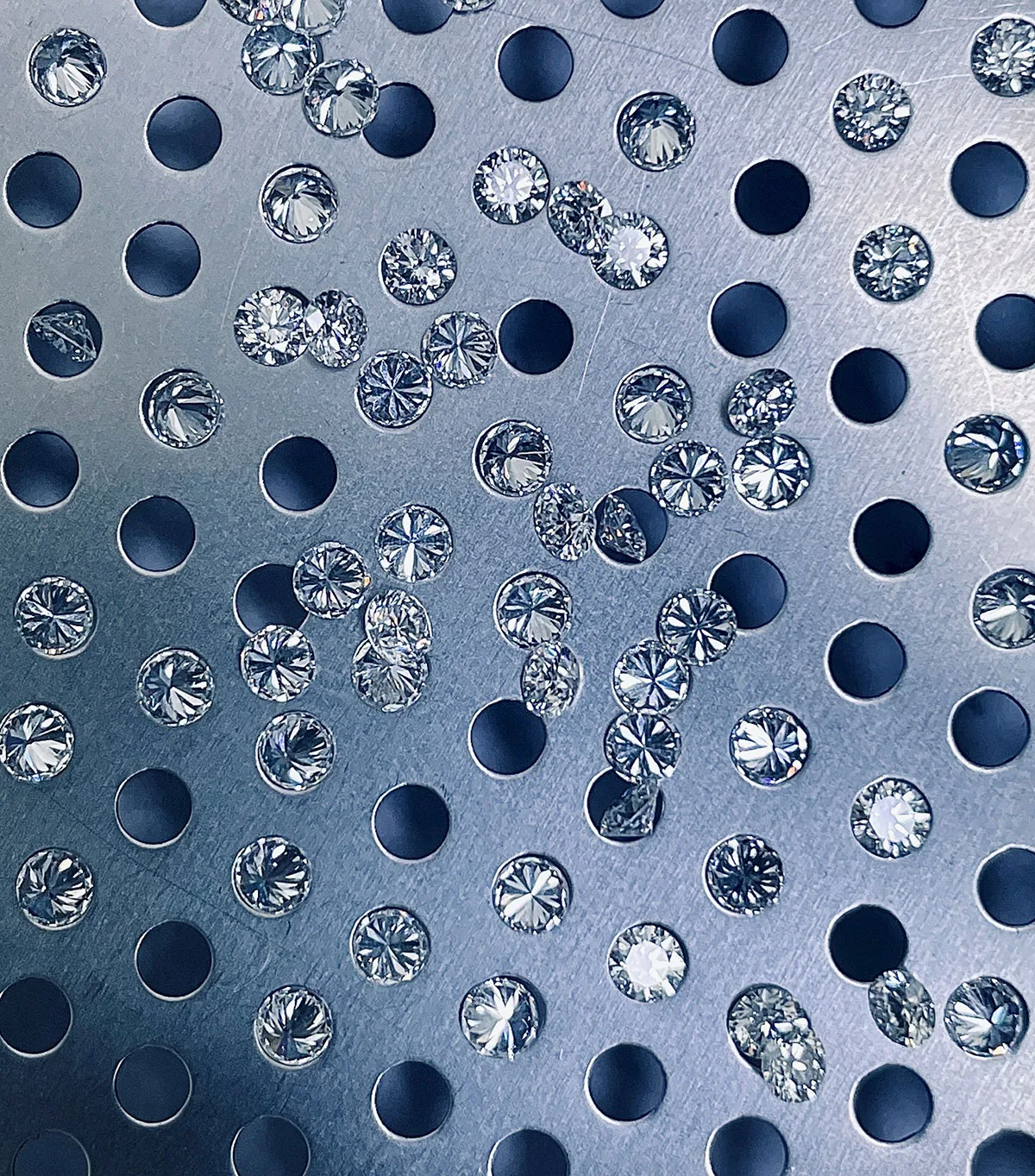 Calibrated natural round diamond melee, sorted and matched